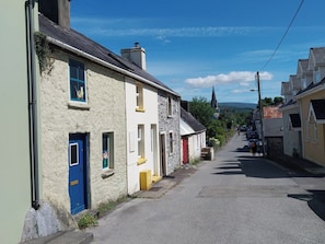 A narrow street lined with traditional buildings, some with stone facades and others with painted exteriors. - ABINA'S, family friendly, with a garden in Kenmare, County Kerry (Kenmare)
