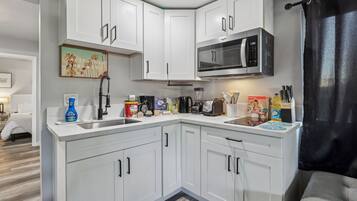 Fridge, microwave, stovetop, coffee/tea maker