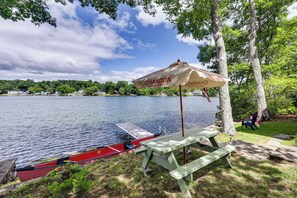 A lakeside picnic area with a bench and a boat dock. - Dock & Sunset Views! Waterfront Thompson Getaway (Thompson)