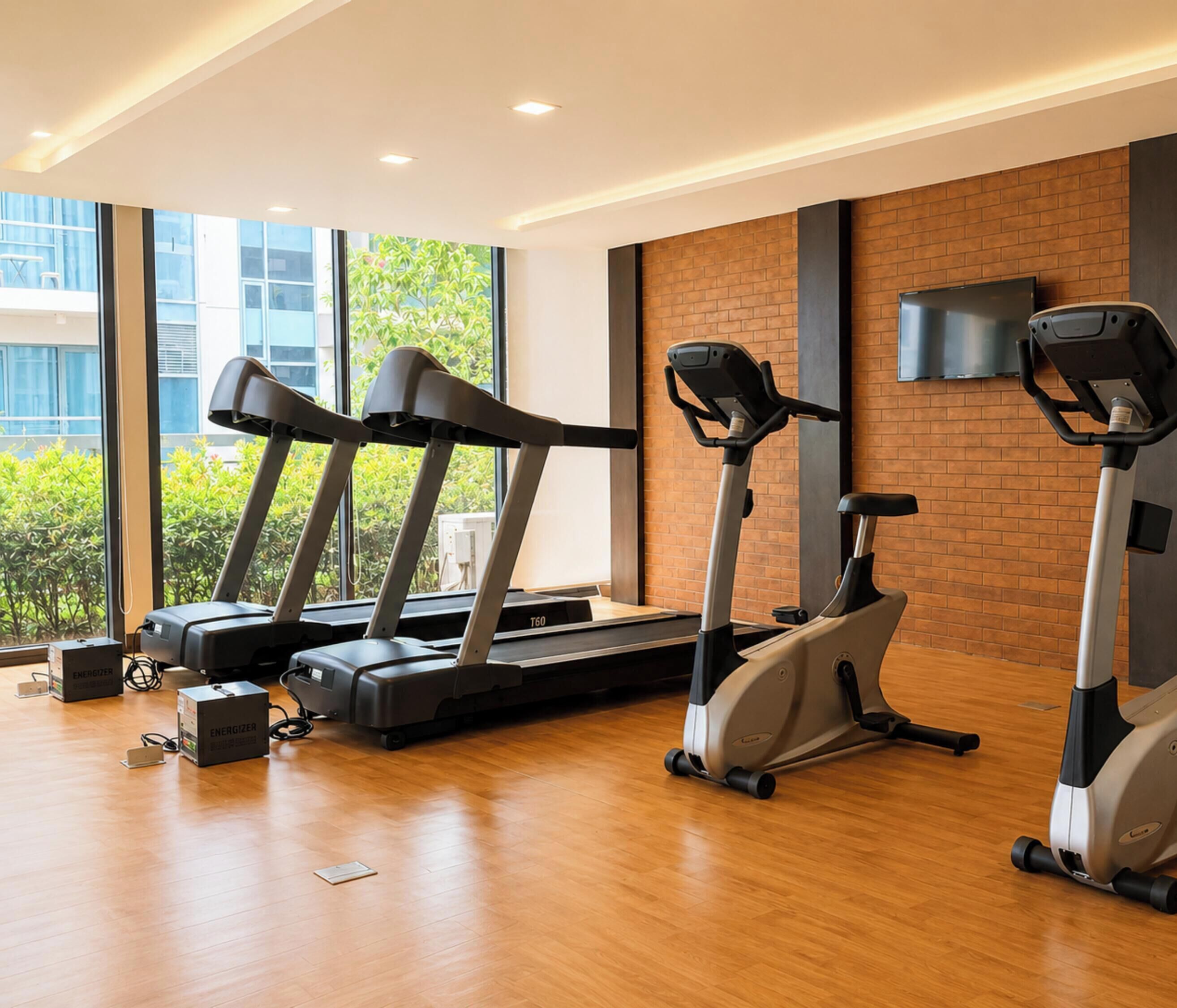 A gym with treadmills, an elliptical, and exercise equipment.