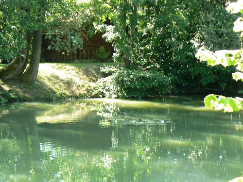 The house, as seen from the property's private pond