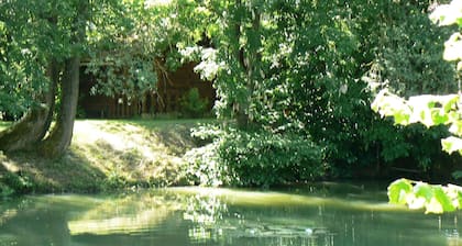 The house, as seen from the property's private pond