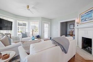 Relax in a bright living space with beautiful ocean views.