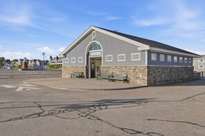 A public restroom building with a stone facade, a pitched roof, and a sign indicating it is part of Ellis Smart Sands Park. - Luxury oceanfront estate, breathtaking ocean views, stunning coastal setting, exceptional amenities, unforgettable getaway. (York)