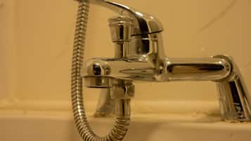 Combined shower/bathtub, deep-soaking bathtub, hair dryer, towels