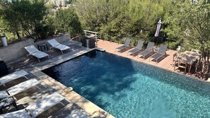 A rooftop pool with lounge chairs and a table, surrounded by trees and buildings. - Exceptional Villa with Pool & Adjoining Apartment - Sleeps 10 (Marseille)