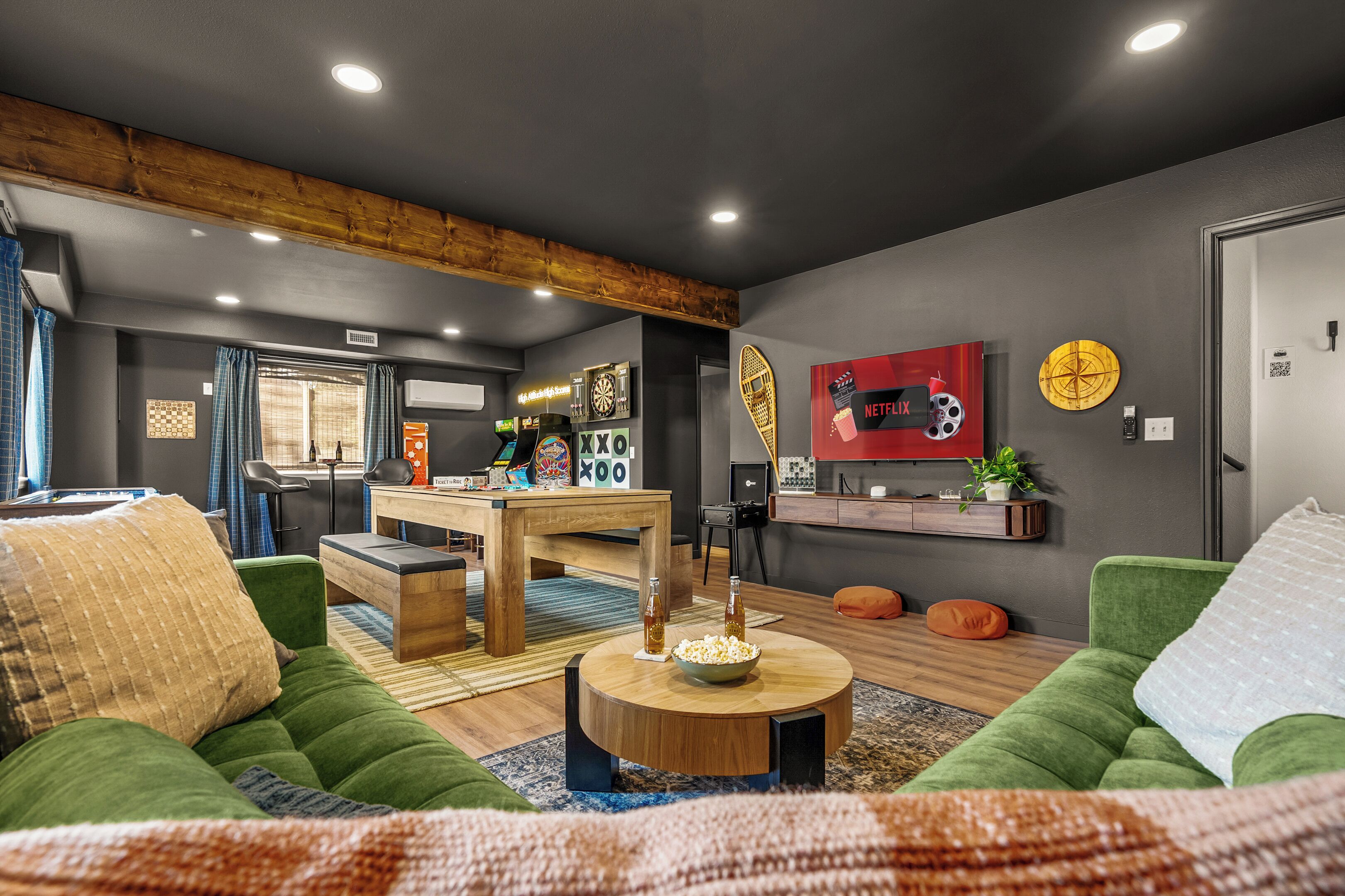 A modern living room with a wooden ceiling, a dartboard, a dartboard, a dartboard, a dartboard, a dartboard, a dartboard, a dartboard, a dartboard, a dartboard, a dartboard, a dartboard, a dartboard, a dartboard, a dartboard, a dartboard, a dartboard, a dartboard, a dartboard, a dartboard, a dartboard, a dartboard, a dartboard, a dartboard, a dartboard, a dartboard, a dartboard, a dartboard, a dartboard, a dartboard, a dartboard, a dartboard, a dartboard, a dartboard, a dartboard, a dartboard, a dartboard, a dartboard, a dartboard, a dartboard, a dartboard, a dartboard, a dartboard, a dartboard, a dartboard, a dartboard, a dartboard, a dartboard,