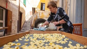 A person working with dough on a large flat surface in an outdoor setting. - Just minutes from the city, perfect for everyone—including families with kids (play area) (Bari)