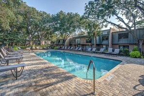 A swimming pool with lounge chairs and a brick patio. - 51 Ocean Club: Oceanfront Villa. 2BD/2BA/Hosts 6 (Hilton Head Island)