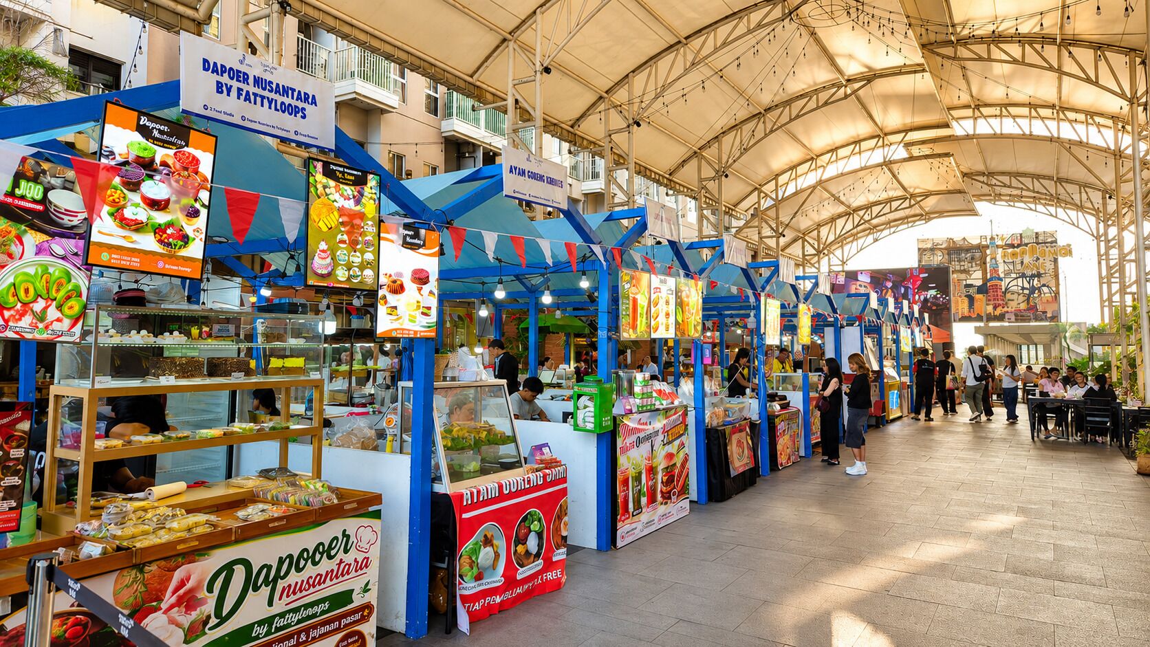 A covered outdoor market with food stalls and a variety of food items on display.