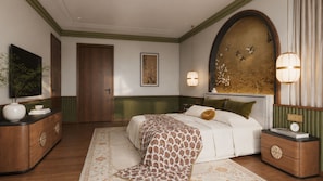 Un dormitorio con una cama grande, un aparador, un televisor y un cuadro en la pared.