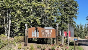 A sign for North Shore Winery with a number 202 signpost nearby. - Aspen Cottage Ski In Ski Out 1BR at Lutsen Mtn (Lutsen)