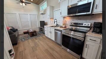 Coffee/tea maker, fridge, microwave, oven