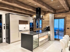 Furniture, Interior Design, Kitchen, Flooring, Floor, Wood, Ceiling, Wood Flooring, Countertop, Chair