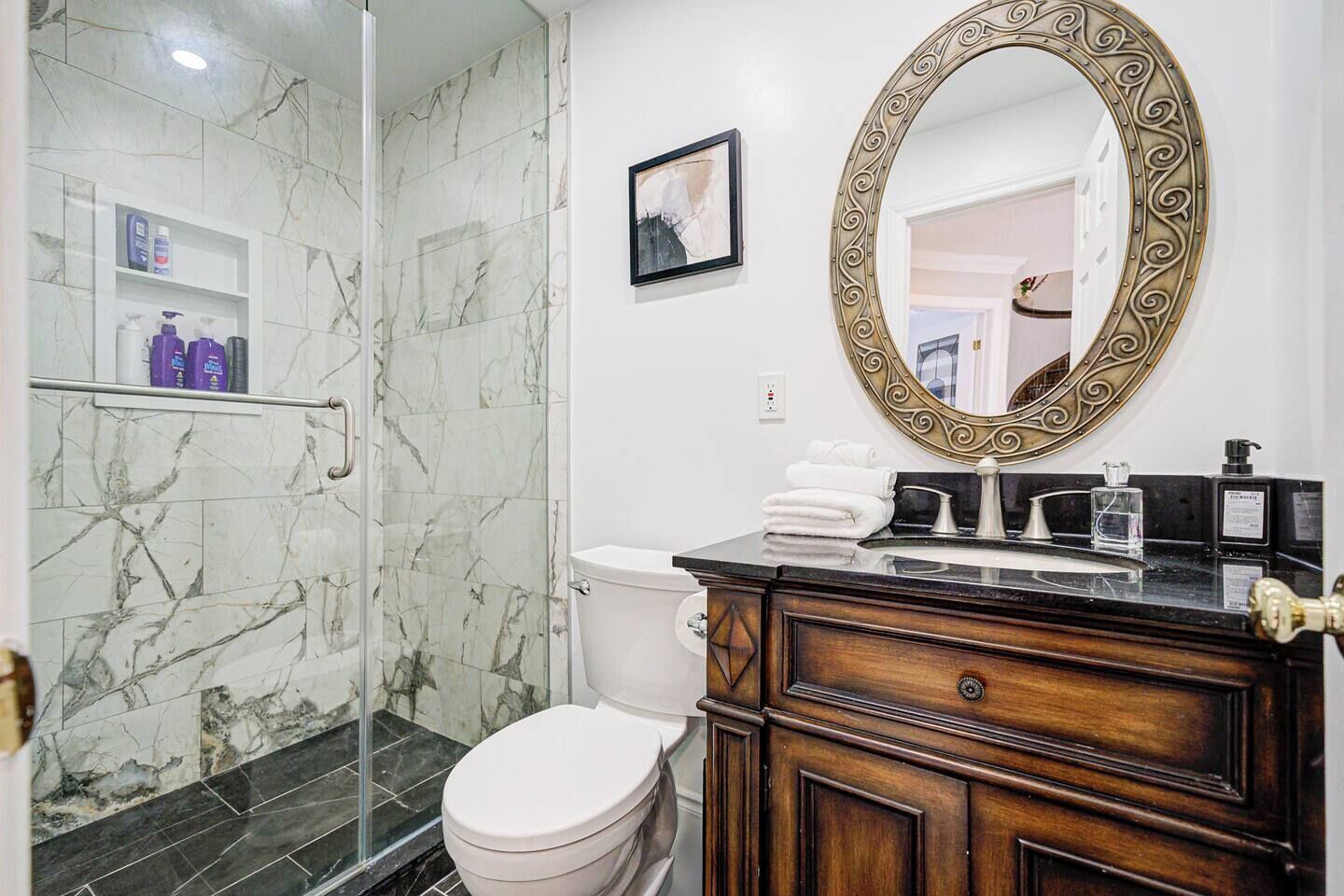 Shower, hair dryer, towels, shampoo