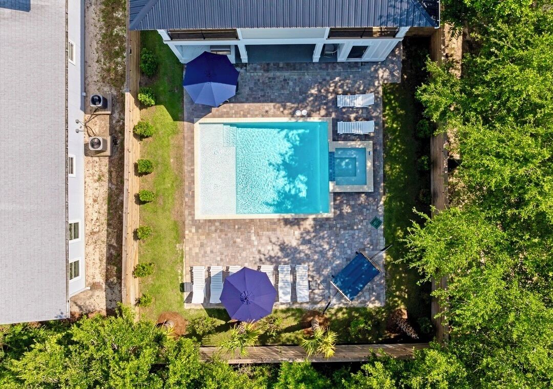 Your private backyard oasis awaits! Relax in the HEATED pool and hot tub spa, soak up the Florida sunshine on lounge chairs, fire up the natural gas grill, and enjoy outdoor dining with family and friends after a day at Crystal Beach.