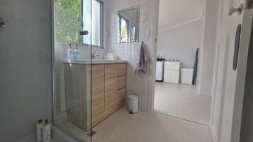 Shower, hair dryer, towels, soap