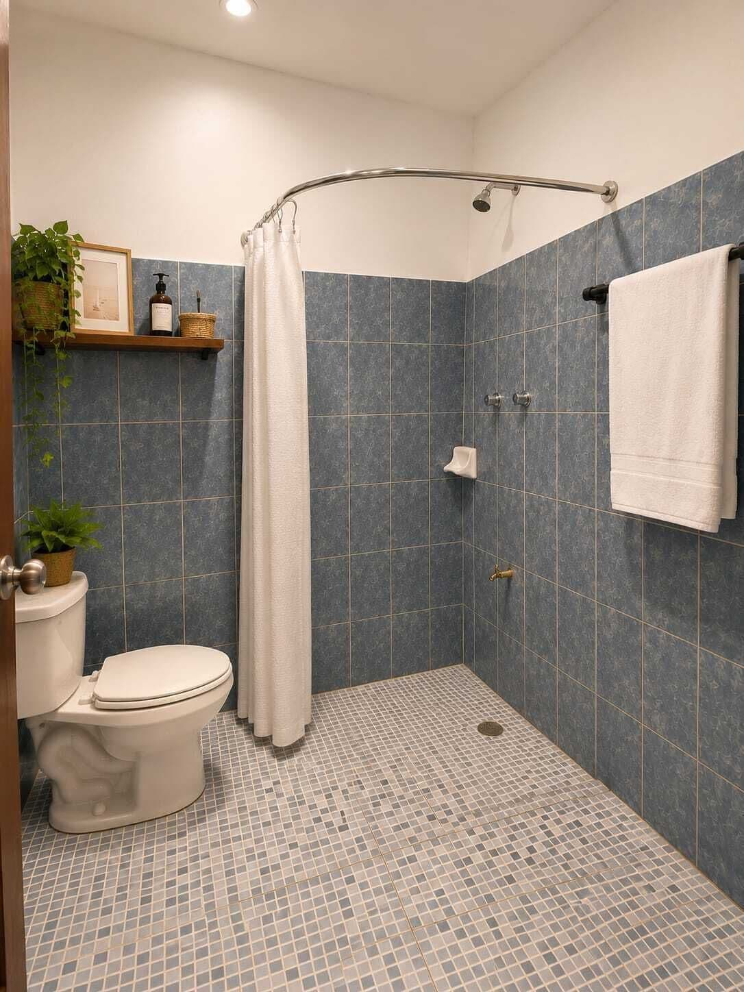 A bathroom with a shower, toilet, and a shelf with toiletries.