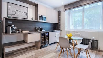 Comfort Apartment, 1 Bedroom, Microwave, City View | Laptop workspace, iron/ironing board, WiFi (free), bed sheets