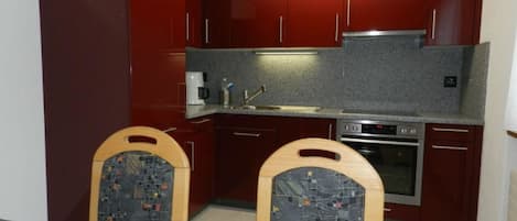 Fridge, oven, cookware/dishes/utensils