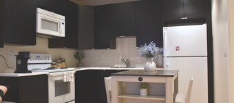 Private 2BR Suite | Kitchen & Laundry