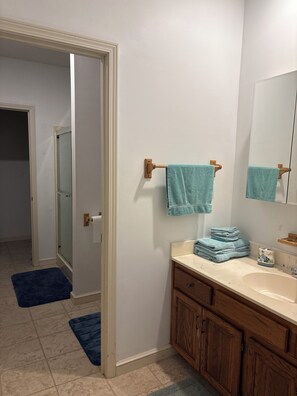 Shower, hair dryer, towels, soap