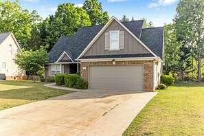 A residential house with a garage, a driveway, and a well-maintained lawn. - Sleep 9 Boiling Springs SC w/2 kings, Pool Table (Boiling Springs)