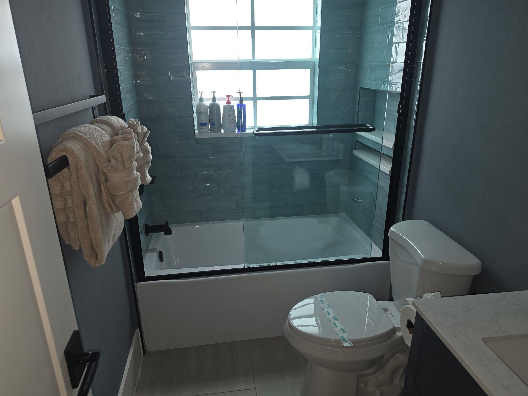 Shower, hair dryer, towels, soap