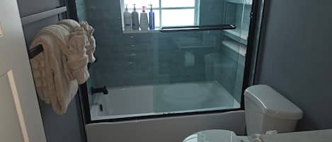Shower, hair dryer, towels, soap