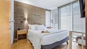 Apartamento standard | Cortinas blackout, ferros/tábuas de passar roupa, Wi-Fi de cortesia
