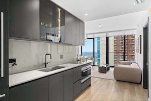 Coffee/tea maker, fridge, microwave, oven - Elite 2BR Condo at E11EVEN with Rooftop Pool (Miami)