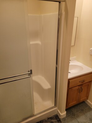 Shower, towels, soap, toilet paper