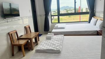 Basic Quadruple Room, City View | Desk, laptop workspace, free WiFi