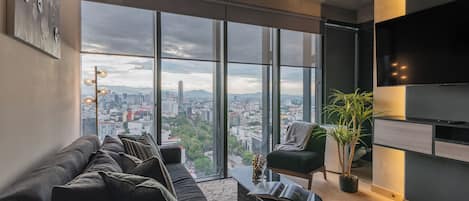 Departamento Confort, vista a la ciudad | Área de sala de estar