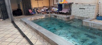 Stunning garden-level apartment with a pool and a steam room