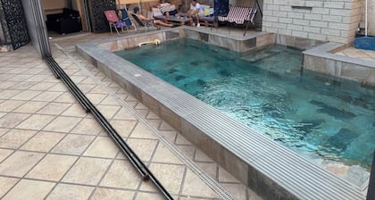 Stunning garden-level apartment with a pool and a steam room