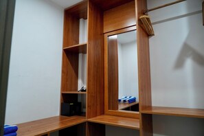 A wooden wardrobe with multiple compartments and a hanging rod. - Cozy Arts Dhangethi (Dhangethi)