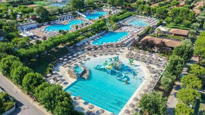 An aerial view of a resort with multiple swimming pools, sun loungers, and a water park. - Piani Di Clodia 2 p4p Clim (Lazise)