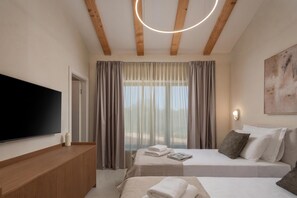 A hotel room with a bed, a bedside table, a flat-screen TV, a window with curtains, and a painting on the wall. - Nareo Villa Collection With Private Pool (Sveta Nedelja)