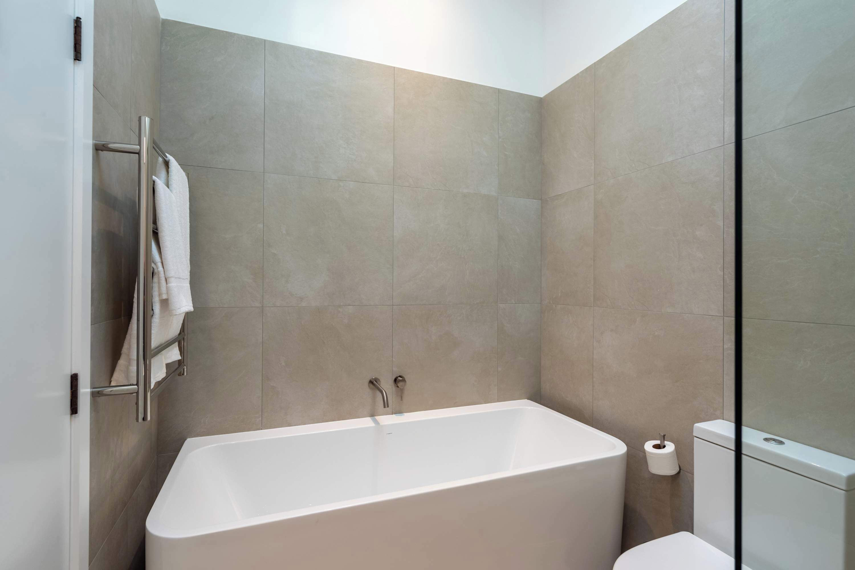 Shower, hair dryer, towels, shampoo