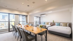 A hotel room with a dining table, chairs, a bed, and a large window. - Eslead Hotel Namba Daikokucho Annex (Daikoku, Naniwa-ku, Osaka-shi)