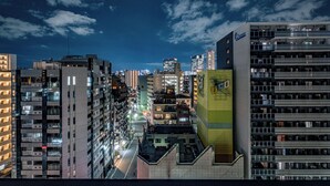 A high-rise building with multiple floors, large windows, and a prominent sign on the side. - Eslead Hotel Namba Daikokucho Annex (Daikoku, Naniwa-ku, Osaka-shi)