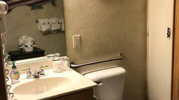 Jetted bath, hair dryer, towels, soap