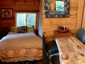 A wooden cabin interior with a bed, a dining table, and a window.