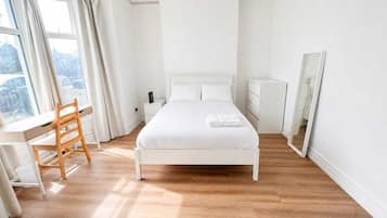 Desk, laptop workspace, free WiFi, bed sheets