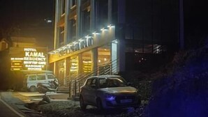 A hotel building with illuminated signage, a visible entrance, and a parked car. - HOTEL KAMAL RESIDENCY BY UK SEASON (Tehri)