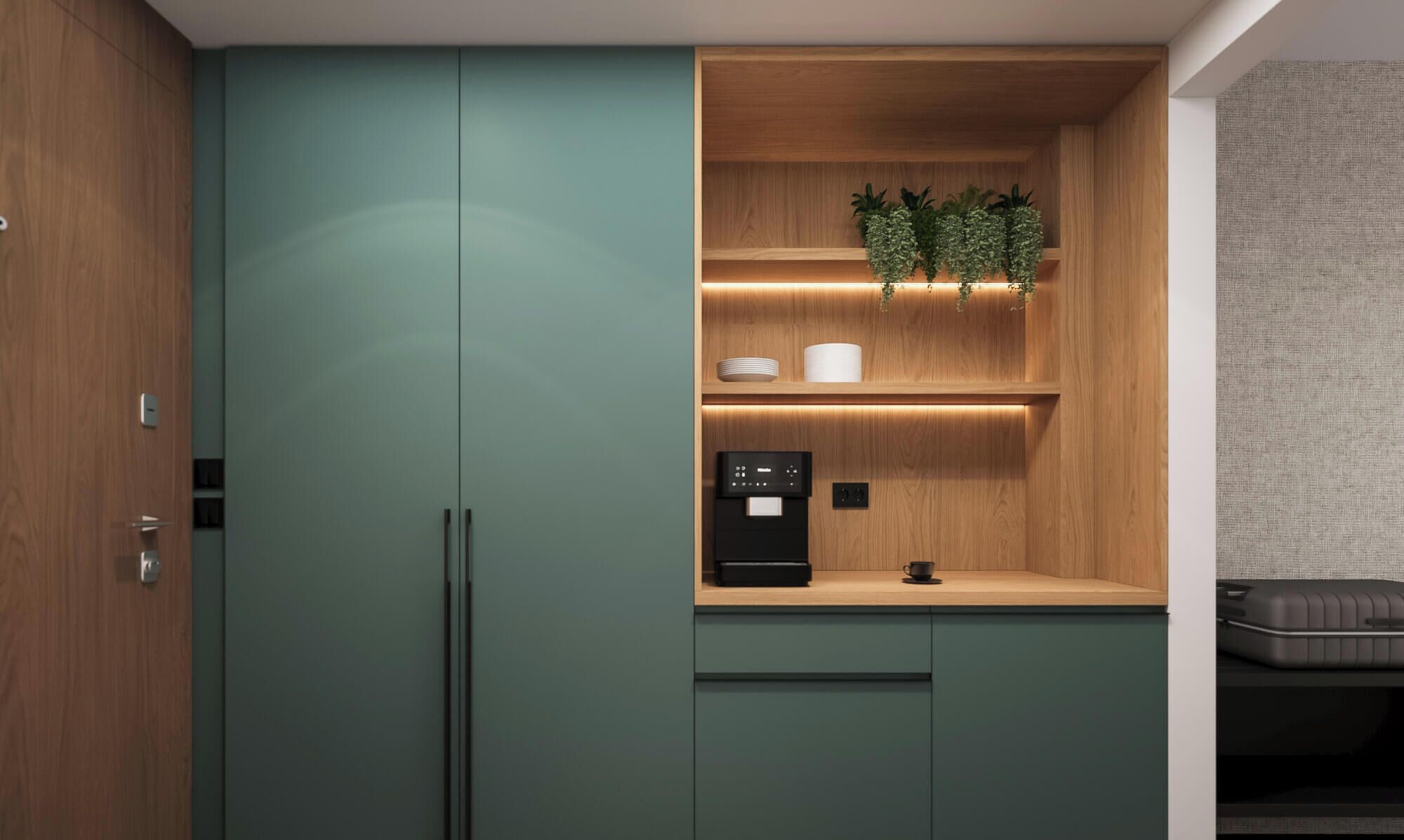 Une petite cuisine compacte équipée d’une machine à café intégrée, d’une petite étagère avec des plantes décoratives et d’un plan de travail en bois.