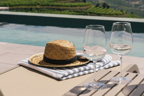 Seasonal outdoor pool, open 8:00 AM to 7:00 PM, pool umbrellas