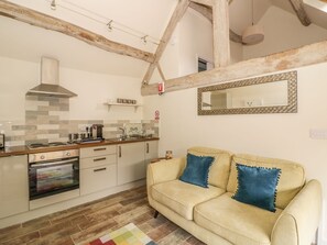 A kitchen with a stove, oven, and hanging lights. - The Bolt Hole (Stratford-upon-Avon)