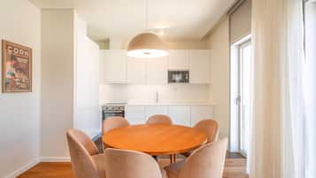 Apartment (Two-Bedroom Apartment with City View) | Private kitchen | Electric kettle, dining tables